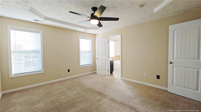 1221 Piping Plover Ct, Fayetteville, NC 28306 - unfurnished bedroom with carpet flooring, baseboards, connected bathroom, and a ceiling fan
