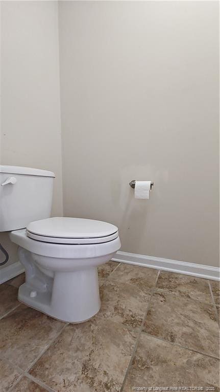 1221 Piping Plover Ct, Fayetteville, NC 28306 - bathroom with toilet and baseboards