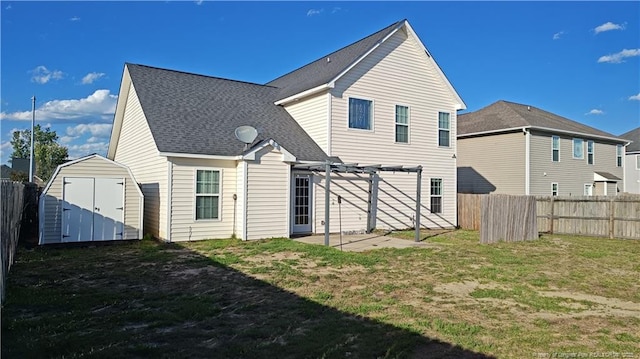 1221 Piping Plover Ct, Fayetteville, NC 28306 - rear view of house with a pergola, a patio, and roof with shingles