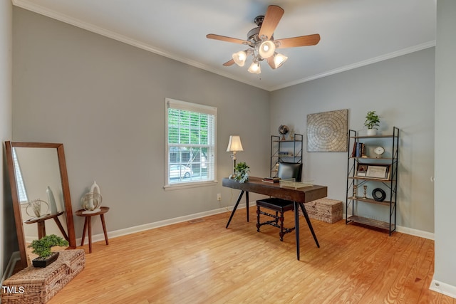 home office featuring light wood-style floors, baseboards, a ceiling fan, and ornamental molding