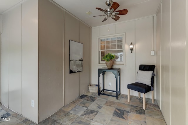 property entrance with a ceiling fan and a patio area