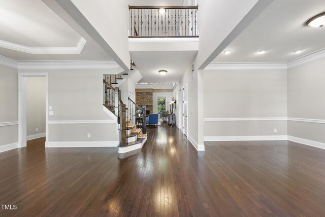 entryway featuring stairway, baseboards, and dark wood-style flooring