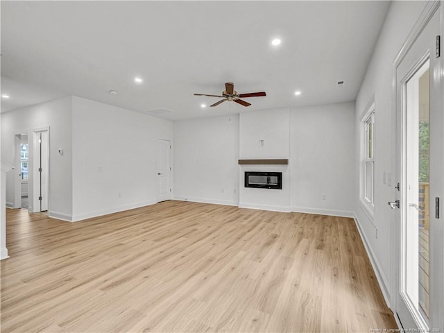 114 Kingwood Dr, Lillington, NC 27546 - unfurnished living room featuring recessed lighting, light wood-style floors, baseboards, and a ceiling fan