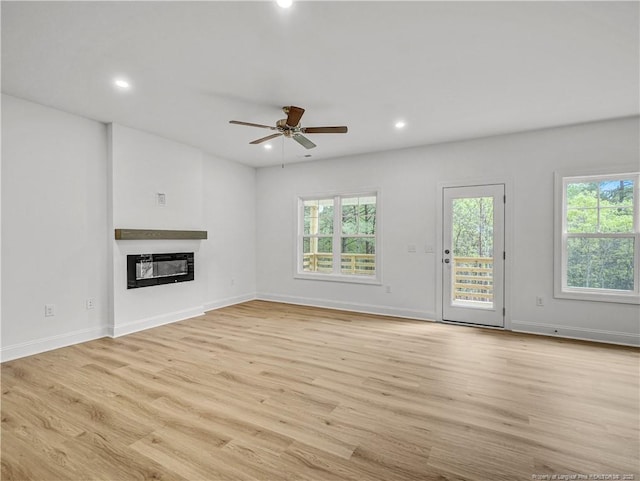 114 Kingwood Dr, Lillington, NC 27546 - unfurnished living room with a wealth of natural light, recessed lighting, light wood-type flooring, and ceiling fan