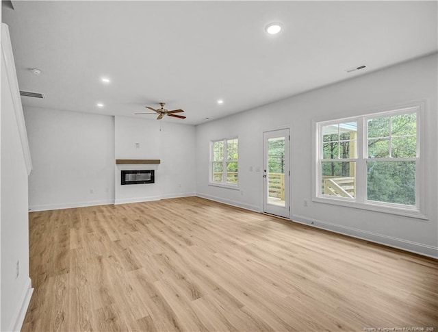 114 Kingwood Dr, Lillington, NC 27546 - unfurnished living room with visible vents, baseboards, a ceiling fan, recessed lighting, and light wood-style flooring