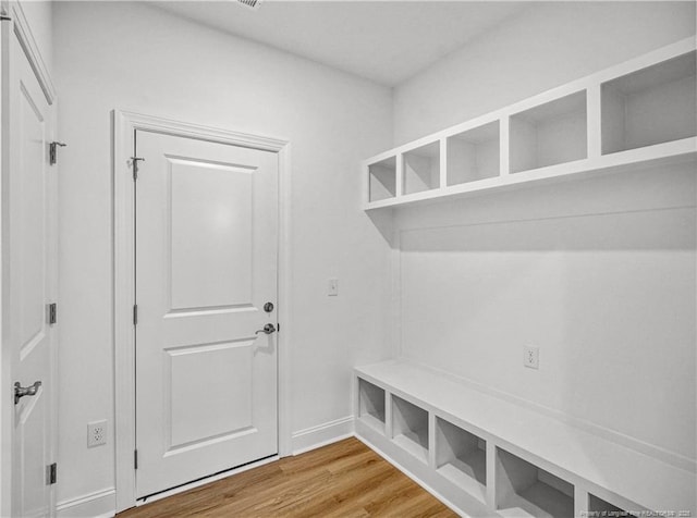 114 Kingwood Dr, Lillington, NC 27546 - mudroom featuring baseboards and light wood finished floors