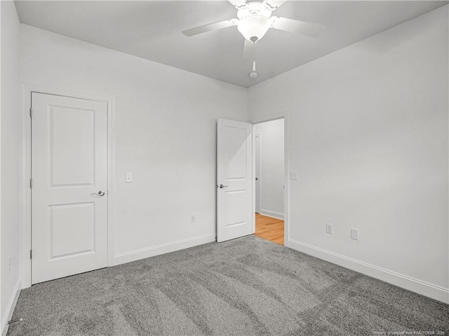 114 Kingwood Dr, Lillington, NC 27546 - unfurnished bedroom with baseboards, a ceiling fan, and carpet