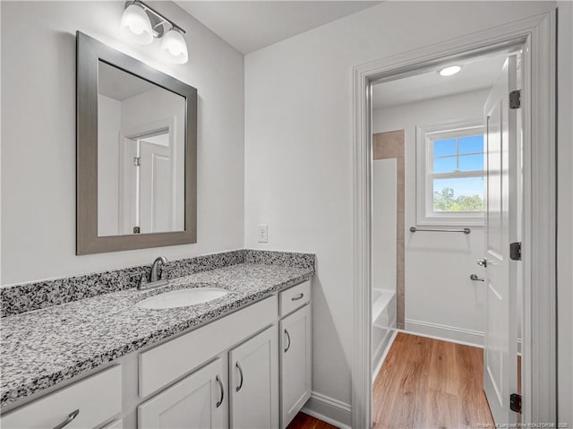 114 Kingwood Dr, Lillington, NC 27546 - full bath featuring vanity, baseboards, and wood finished floors