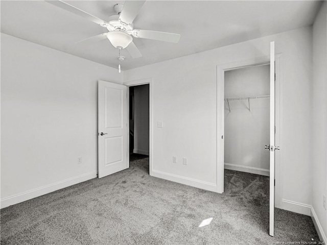 114 Kingwood Dr, Lillington, NC 27546 - unfurnished bedroom with a closet, carpet flooring, a spacious closet, and baseboards