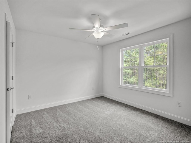 114 Kingwood Dr, Lillington, NC 27546 - carpeted empty room with baseboards, a ceiling fan, and visible vents