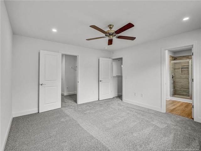 114 Kingwood Dr, Lillington, NC 27546 - unfurnished bedroom featuring a closet, a spacious closet, recessed lighting, carpet floors, and baseboards