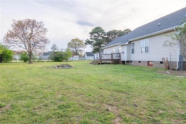 106 Celestial Pl, Pikeville, NC 27863 - view of yard featuring an outdoor fire pit and a deck