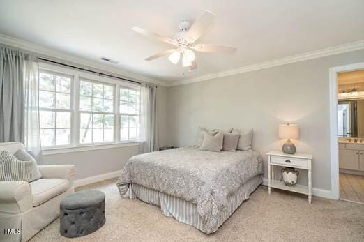 bedroom with ornamental molding, baseboards, and multiple windows