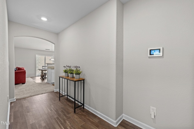 2040 Alderman Way, Creedmoor, NC 27522 - hallway featuring arched walkways, dark wood finished floors, and baseboards