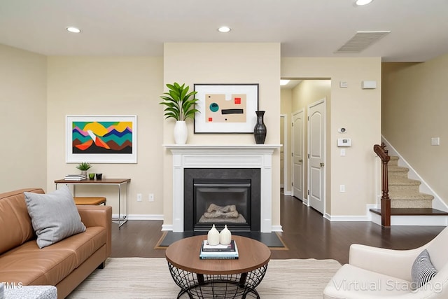 7229 Terregles Dr, Raleigh, NC 27617 - living room featuring visible vents, wood finished floors, stairway, and recessed lighting