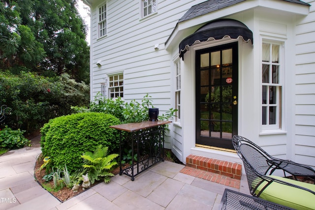 doorway to property featuring a patio