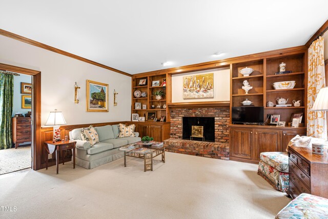 carpeted living room with crown molding, a fireplace, and built in shelves