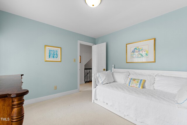 bedroom with carpet flooring and baseboards
