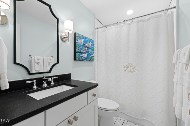 bathroom featuring toilet, vanity, recessed lighting, and a shower with shower curtain