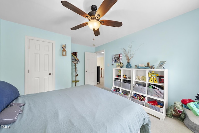 carpeted bedroom featuring ceiling fan