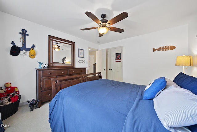 bedroom featuring carpet, a ceiling fan, and baseboards