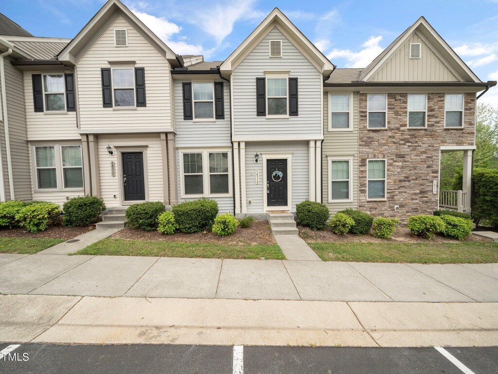 14315 Foxcroft Rd, Raleigh, NC 27614 - view of property featuring stone siding and board and batten siding