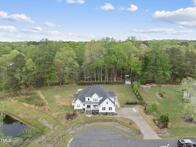 6024 Lunenburg Dr, Raleigh, NC 27603 - drone / aerial view with a water view and a wooded view
