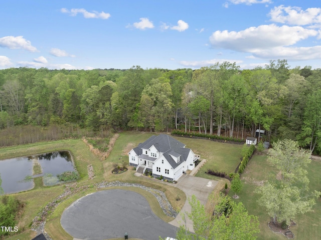 6024 Lunenburg Dr, Raleigh, NC 27603 - drone / aerial view with a wooded view and a water view
