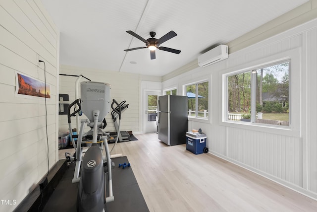 6024 Lunenburg Dr, Raleigh, NC 27603 - exercise area featuring plenty of natural light, light wood finished floors, a wall unit AC, and ceiling fan