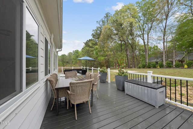 6024 Lunenburg Dr, Raleigh, NC 27603 - wooden deck with an outdoor hangout area, outdoor dining space, and a lawn