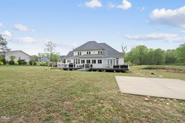 6024 Lunenburg Dr, Raleigh, NC 27603 - back of house with a wooden deck and a yard
