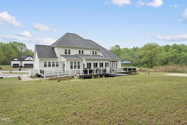 6024 Lunenburg Dr, Raleigh, NC 27603 - back of house with a wooden deck, a yard, and roof with shingles