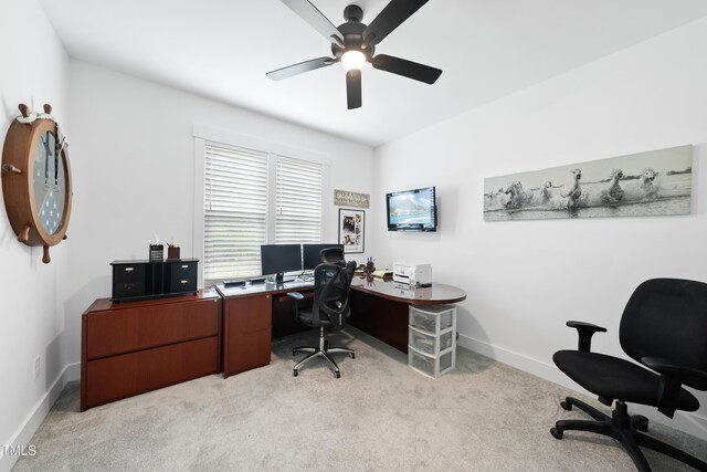 6024 Lunenburg Dr, Raleigh, NC 27603 - office area featuring light carpet, a ceiling fan, and baseboards