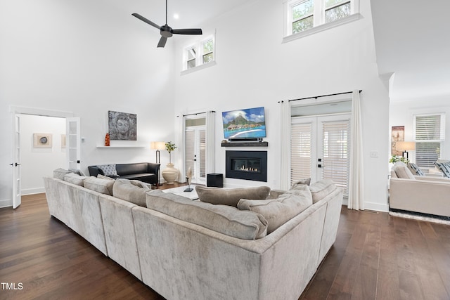 6024 Lunenburg Dr, Raleigh, NC 27603 - living room featuring a towering ceiling, dark wood-style floors, and ceiling fan