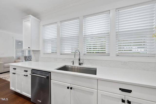 6024 Lunenburg Dr, Raleigh, NC 27603 - kitchen featuring white cabinets, a wealth of natural light, a sink, and dark wood-style flooring