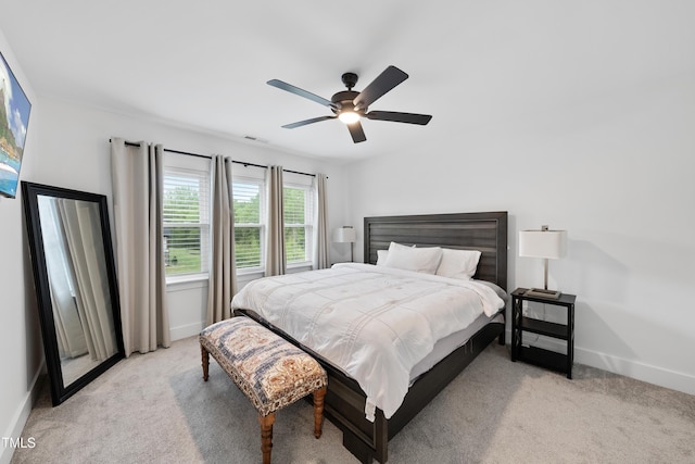 6024 Lunenburg Dr, Raleigh, NC 27603 - bedroom featuring ceiling fan, light carpet, visible vents, and baseboards