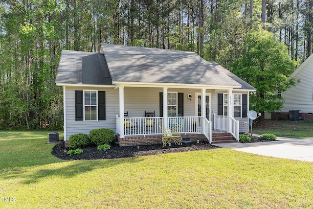2112 Ballston Pl, Knightdale, NC 27545 - ranch-style house with central air condition unit, a shingled roof, a front yard, and covered porch