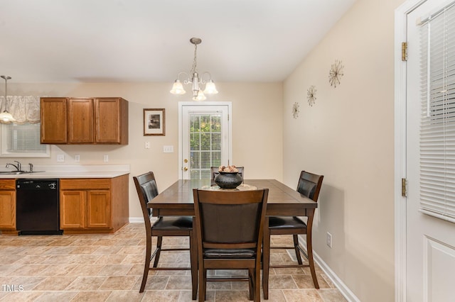 2112 Ballston Pl, Knightdale, NC 27545 - dining area with stone finish flooring, baseboards, and a chandelier