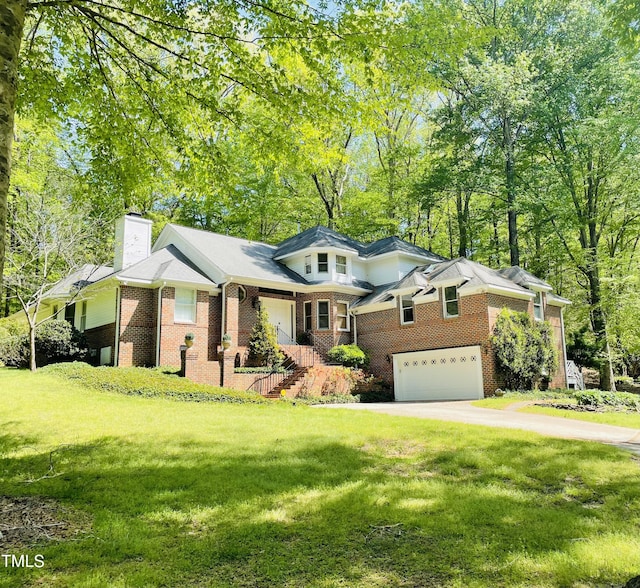 6212 Trevor Ct, Raleigh, NC 27613 - view of front of house featuring an attached garage, brick siding, a front yard, and concrete driveway