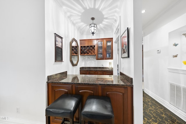 6212 Trevor Ct, Raleigh, NC 27613 - bar featuring crown molding, a dry bar, decorative light fixtures, baseboards, and visible vents