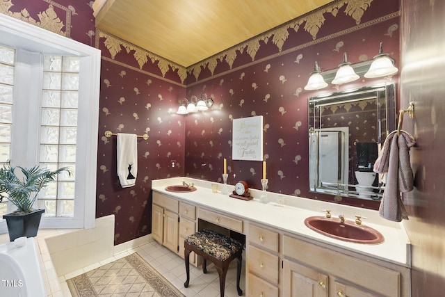 6212 Trevor Ct, Raleigh, NC 27613 - full bath featuring tile patterned flooring, double vanity, a sink, and a stall shower