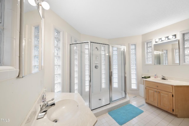 6212 Trevor Ct, Raleigh, NC 27613 - full bath featuring vanity, tile patterned floors, and a stall shower
