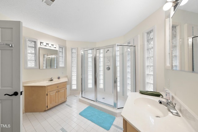 6212 Trevor Ct, Raleigh, NC 27613 - full bathroom featuring a shower stall, visible vents, a sink, and plenty of natural light
