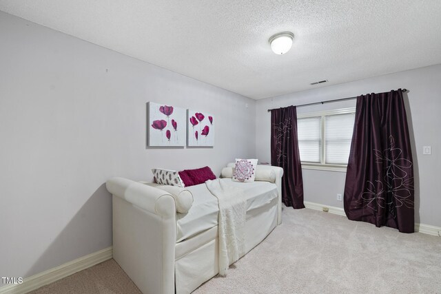 6212 Trevor Ct, Raleigh, NC 27613 - carpeted bedroom with a textured ceiling, baseboards, and visible vents