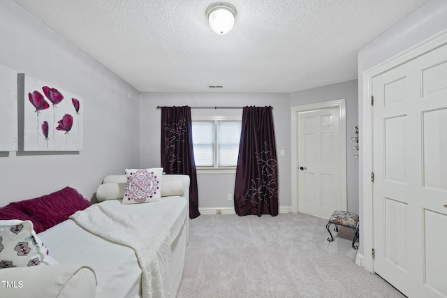 6212 Trevor Ct, Raleigh, NC 27613 - bedroom featuring light colored carpet, baseboards, and a textured ceiling