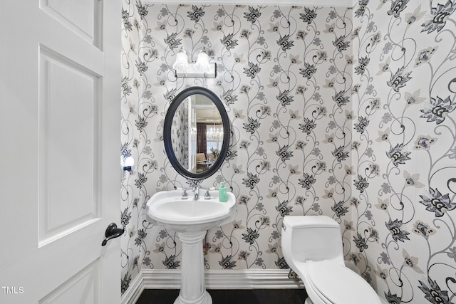6212 Trevor Ct, Raleigh, NC 27613 - half bathroom with baseboards, toilet, and wallpapered walls