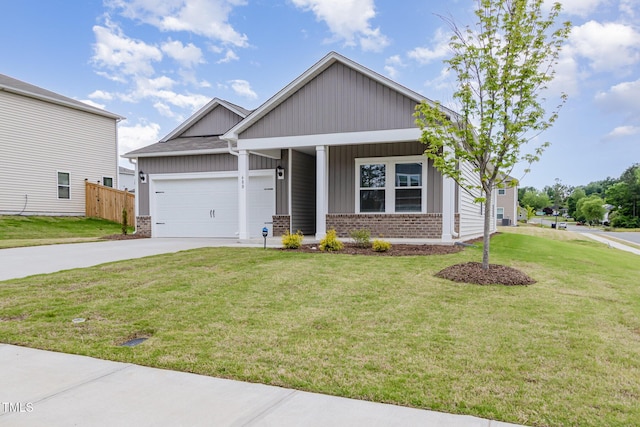 680 Winesap Dr, Graham, NC 27253 - craftsman-style home featuring brick siding, board and batten siding, concrete driveway, a garage, and a porch