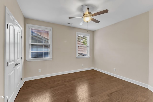 644 Angelica Cir, Cary, NC 27518 - spare room with baseboards, dark wood-type flooring, and ceiling fan