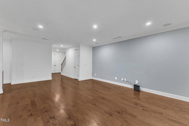 644 Angelica Cir, Cary, NC 27518 - below grade area with recessed lighting, crown molding, wood finished floors, baseboards, and stairway