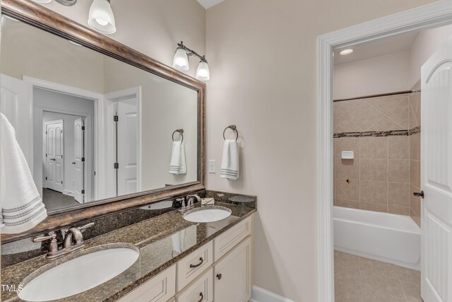 644 Angelica Cir, Cary, NC 27518 - full bath with double vanity, tile patterned floors, and tub / shower combination
